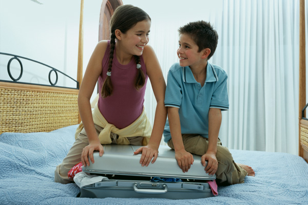 children packing suitcases