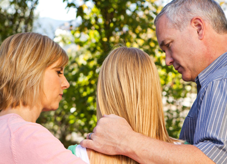 Parents explaining divorce to teen