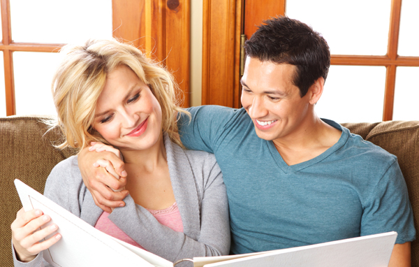 Couple looking at wedding album