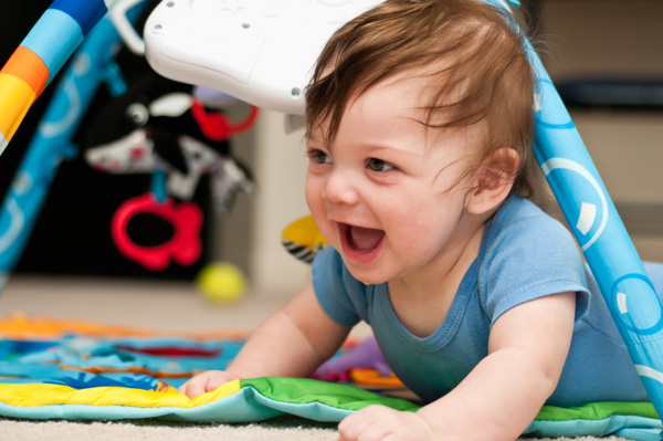 baby playing on mat