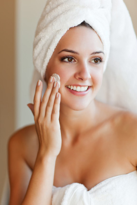 Woman applying face cream