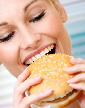 http://cdn.sheknows.com/articles/2012/04/woman-eating-healthy-fast-food.jpg
