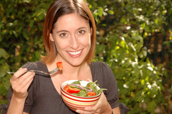 Woman eating salad