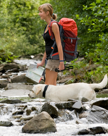 Woman hiking with dog