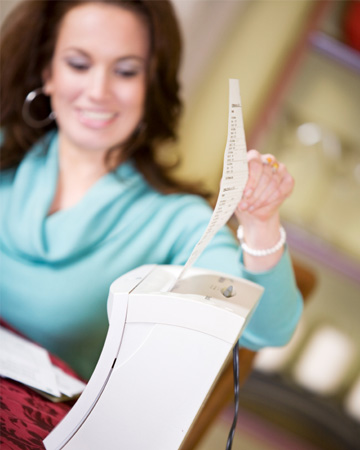 Woman shredding paper