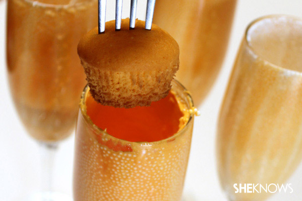 Adding cupcake to champagne glass
