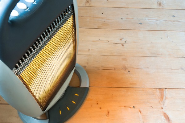 electric space heater on wood flooring