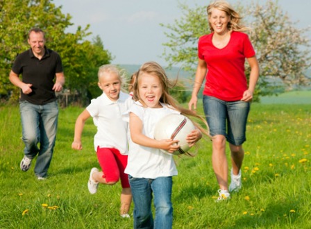 Family playing ball together