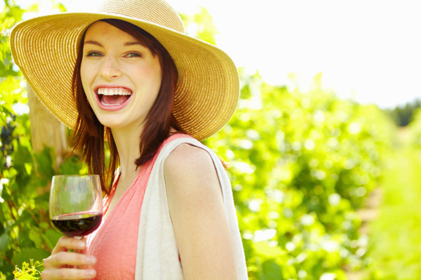 Happy woman drinking wine