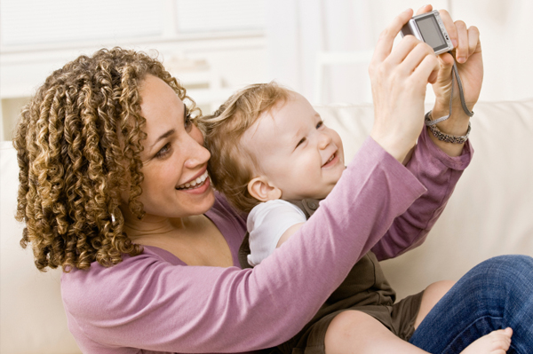 mom and child with digital camera