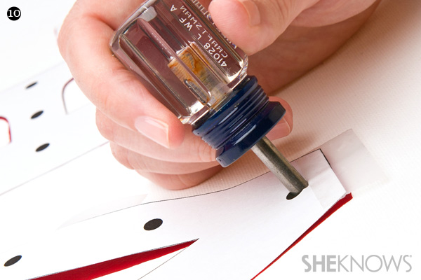 DIY craft project step 10: Punch through canvas with an awl