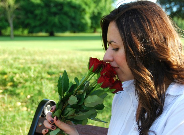 Woman smelling the roses
