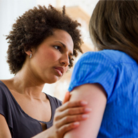 Woman consoling friend