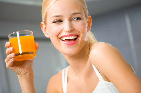 Woman drinking orange juice