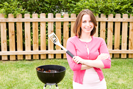 Woman grilling outdoors