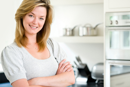Woman in organized kitchen