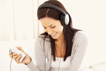 Woman listening to music on headphones