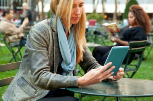 Woman reading with e-reader