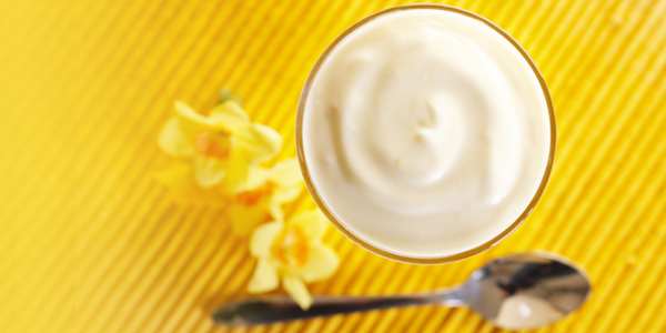 bowl of yogurt on yellow placemat