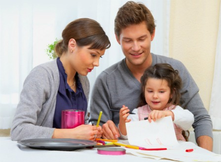 Young girl with coloring pages
