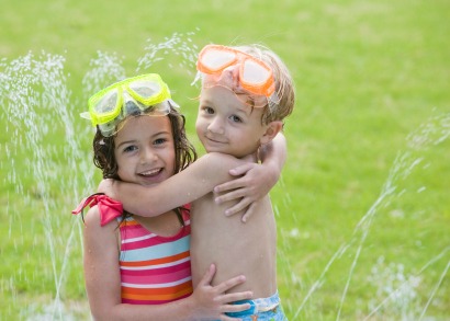 kids playing in sprinklers