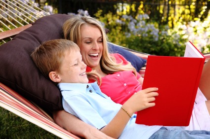 mom and son reading in hammock