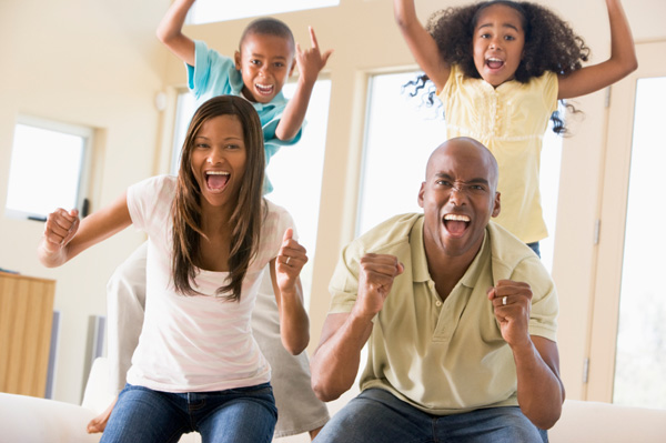 Dad and family watching sports on tv