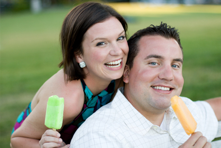 Friends having ice pops at party