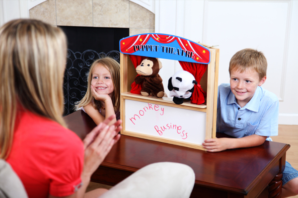kids putting on puppet show