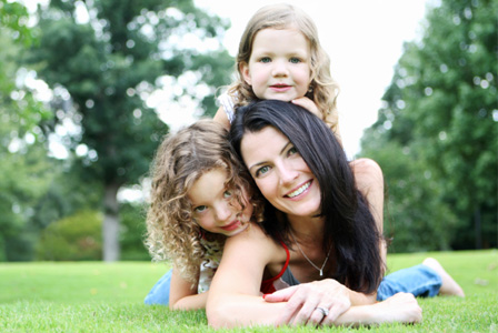 Mom with daughters in the summer