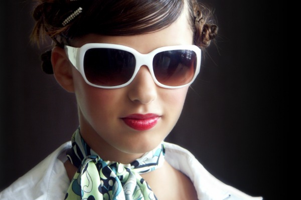 Woman with retro sunglasses and scarf