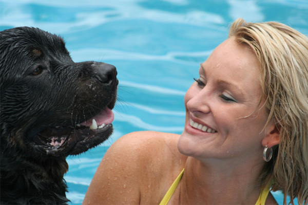woman and dog swimming