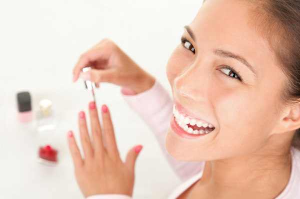 Woman painting her nails