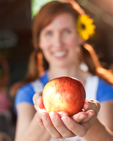 Woman holding an apple