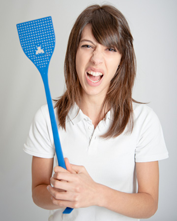 Woman with fly swatter