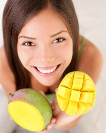 Woman with mangos