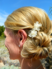 Ivory flower in bride's hair
