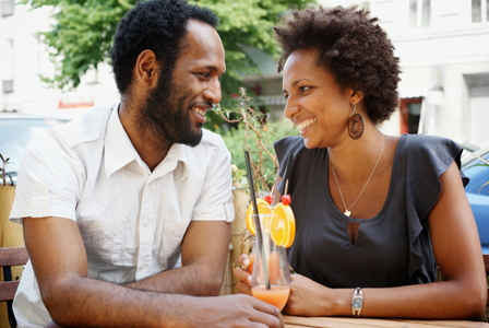 Happy couple having cocktails