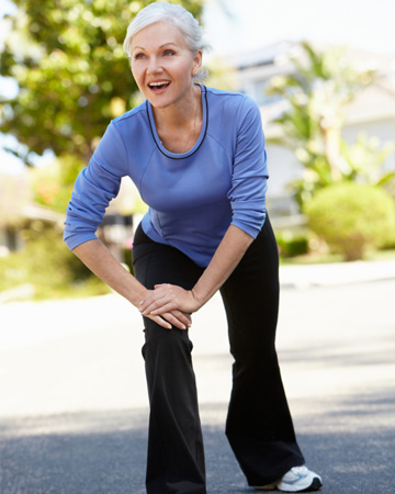 woman in her 50s stretching