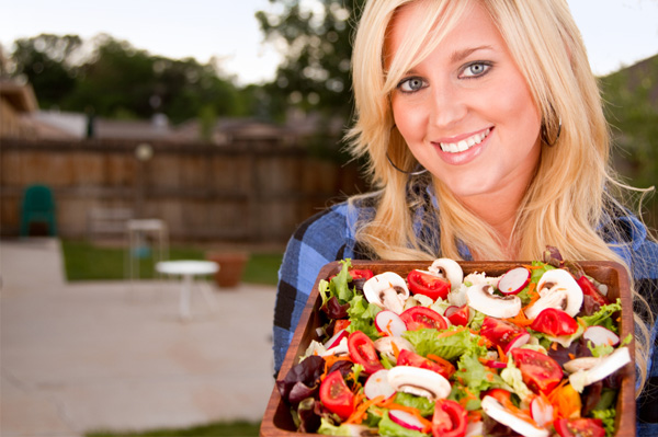 Woman with a big salad