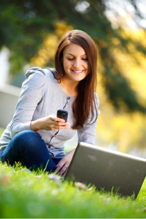 woman turning on mobile hotspot for laptop