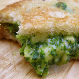 Green grilled cheese sandwich with spinach, avocado and gouda