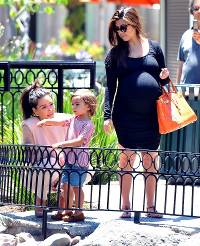 Kim and Kourtney Kardashian with Mason