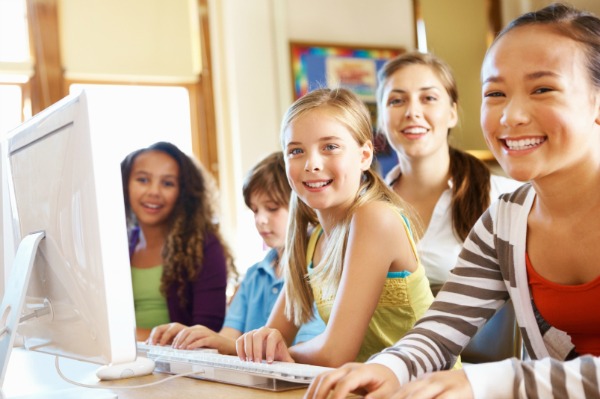 class working on computer using skype