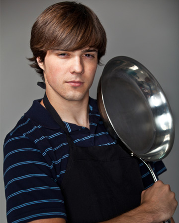 College boy with frying pan