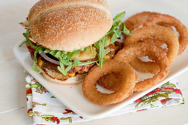Homemade veggie burgers with spicy avocado spread and onion rings recipe