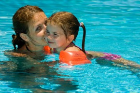 Mom and daughter swimming