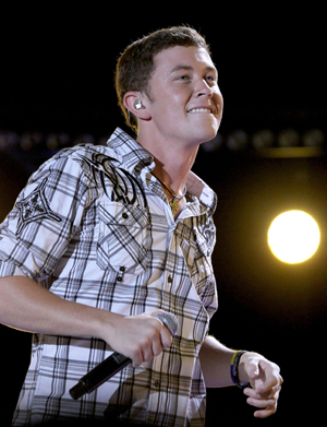 Scotty McCreery falls off stage