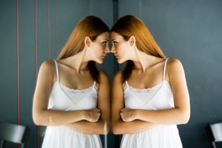 Teen looking in the mirror