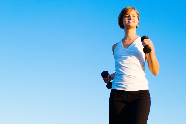 woman power walking with weights